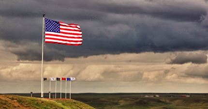 flags in front of stormy clouds